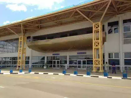 Main entrance view of Bulawayo Airport with yellow geometric steel columns