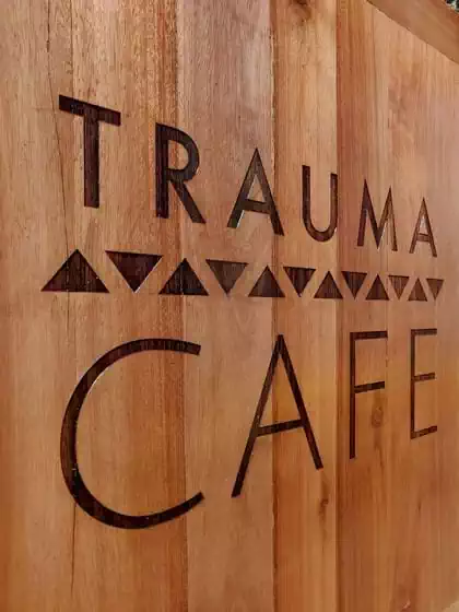 Fun coffee shop modern interior design with wooden cladding and wooden elements by architect in Harare